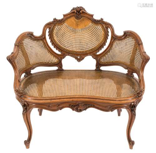 A French carved walnut, marquise-shaped chair:,