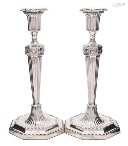 A pair of George V silver candlesticks, maker John Round & Sons Ltd,