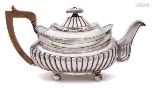 A George III silver teapot, Michael Starkey, London, 1809: crested,