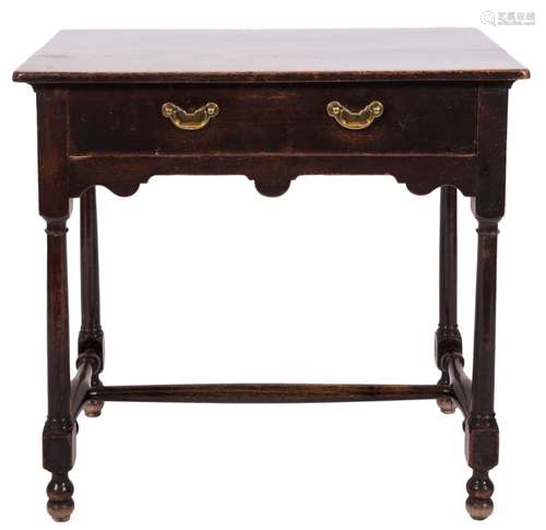 An 18th century oak and fruitwood rectangular side table: with an overhanging top,