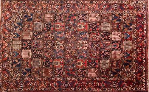 A Bakhtiar garden carpet:, the compartmented field with palmettes,