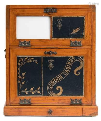 A late Victorian satin walnut Gordon writing cabinet: the upper fall front with tooled leather