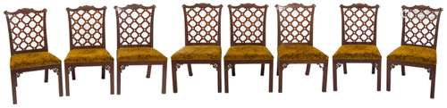 A fine set of eight George III carved mahogany dining chairs in the manner of Robert Manwaring:,