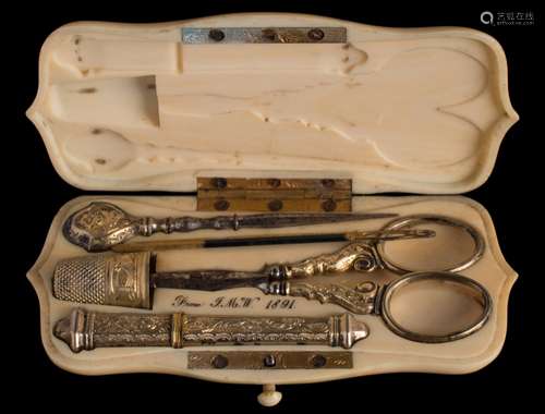 A Victorian ivory etui: of cartouche -shaped outline, bearing initials,