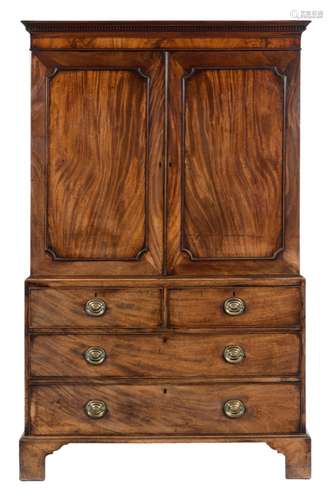 An early 19th Century mahogany crossbanded and inlaid secretaire chest:,