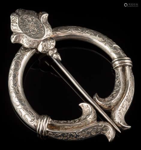 A Victorian silver penannular brooch: engraved overall with floral and foliate scroll motifs,