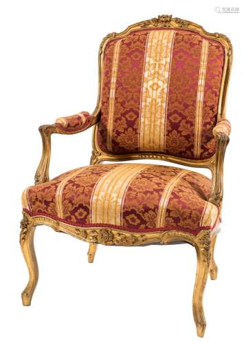 A carved giltwood fauteuil in the Louis XV taste:,