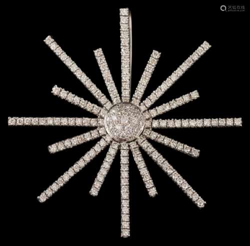 A modern diamond star burst pendant/brooch: pave-set with round brilliant-cut diamonds,