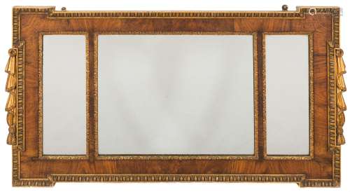 A walnut and partly gilt landscape wall mirror: of rectangular broken outline,