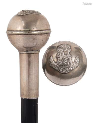 A 20th century ebonised and silver plate mounted walking stick: the pommel with Prince of Wales