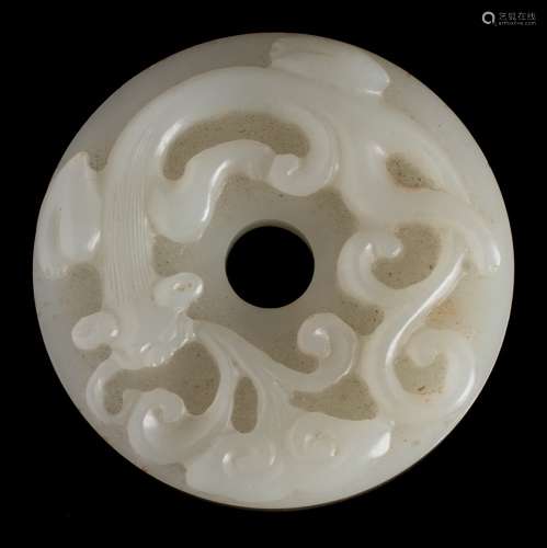 A Chinese 'chilong' jade disc, bi: the stone of pale celadon colour,