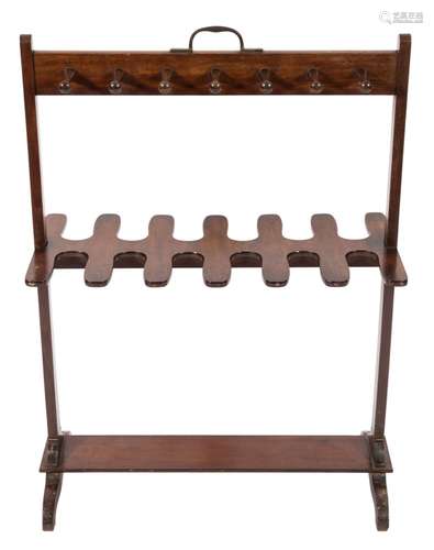 An early 19th Century mahogany riding boot and whip rack:, with central carrying handle,