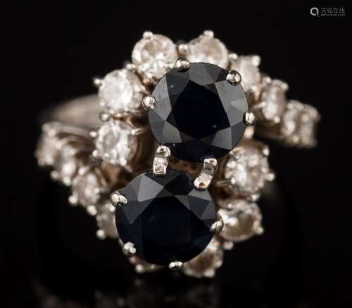 A sapphire and diamond cross-over cluster ring: with two circular sapphires each approximately 6.