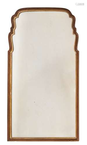 A Queen Anne walnut and partly gilt mirror:, of cartouche outline,