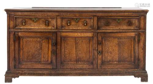 An 18th Century oak rectangular dresser base:, the top with a moulded edge,