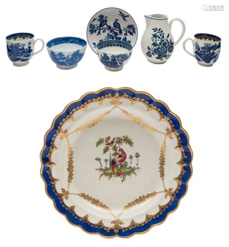 A First Period Worcester dessert plate and six pieces of blue and white porcelain: the plate