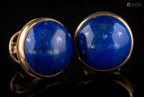 A pair of cabochon circular lapis lazuli single stone ear-studs: each lapis lazuli approximately