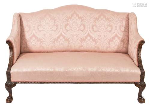 A carved mahogany semi wing frame settee in the Georgian taste:, with a serpentine stuff over back,