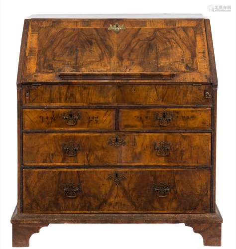 An early 18th Century walnut veneered and cross and feather banded bureau:,