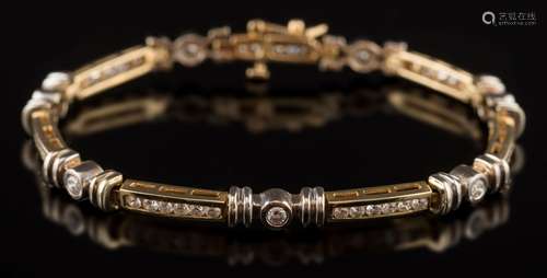 A modern diamond line bracelet: with round, brilliant-cut diamonds and stamped '14K',