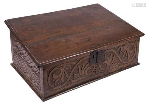 An early 18th Century oak bible box:, with a plain sloping hinged top,