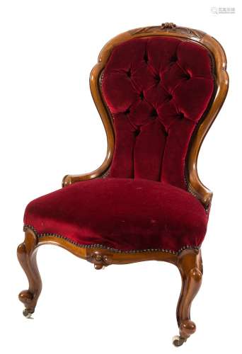 A Victorian carved walnut nursing chair:,