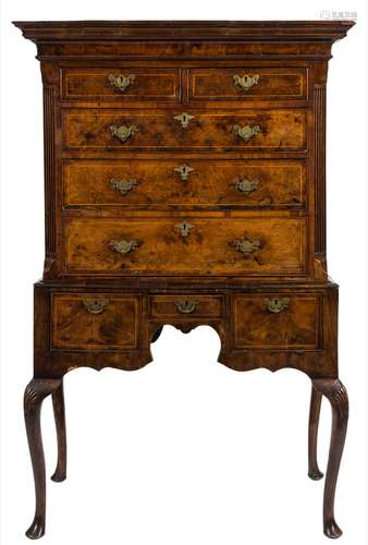 An early 18th Century walnut and inlaid chest on stand:, bordered with sycamore lines,