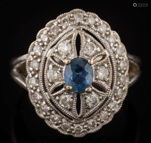 A modern 18ct white gold, sapphire and diamond oval cluster ring: with central oval sapphire 4.