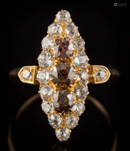 A Victorian cognac coloured diamond and diamond marquise-shaped cluster ring: with three round old,