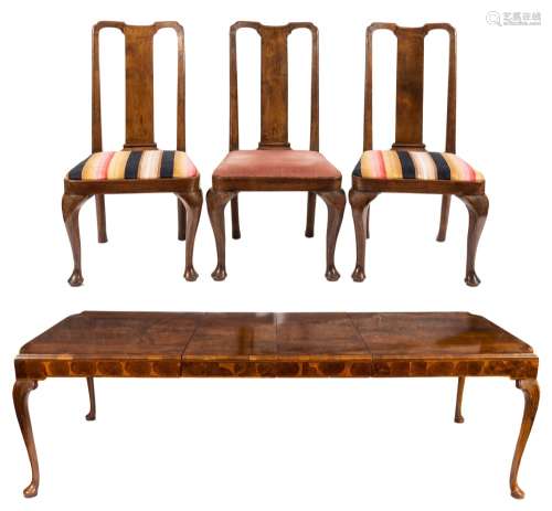 A walnut veneer extending dining table and set of twelve dining chairs in the George I taste:,