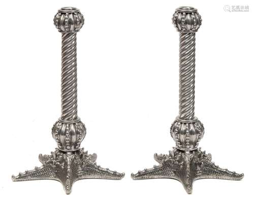 A pair of metal table candlesticks: with bulbous and reeded nozzles,