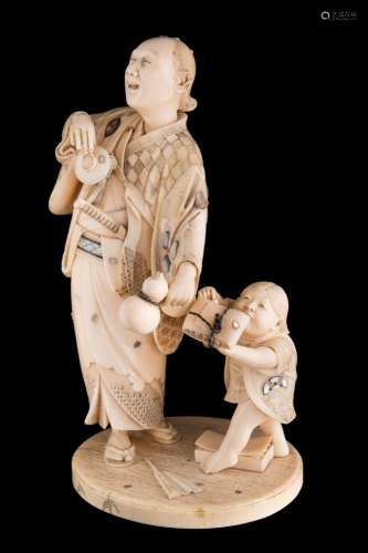 A fine Japanese carved and inlaid ivory okimono, signed Gyokusai: inlaid with mother of pearl,