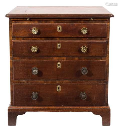 A George III mahogany chest of small size;, the top with a moulded edge and rounded corners,