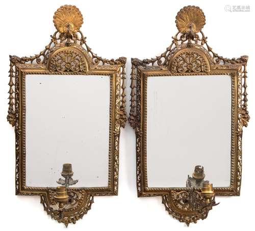 A pair of late 19th century gilt-brass girandole mirrors: each with peacock finial and single