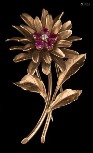 A ruby and diamond mounted 'flower' brooch: with oval-cut rubies and a single old-cut diamond,