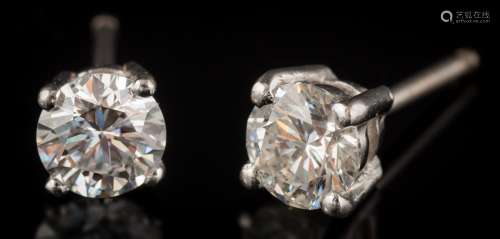 A pair of diamond single-stone ear-studs: each with a circular brilliant-cut diamond approximately