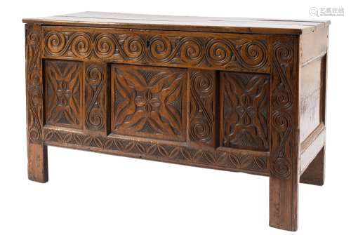 An early 18th Century carved oak rectangular coffer:, with a plain hinged top,