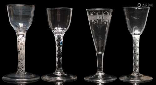 A mixed group of English glasses: comprising an example with rounded funnel bowl set on a double