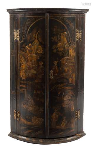 An 18th Century black lacquer and chinoiserie bow-fronted hanging corner cupboard:,