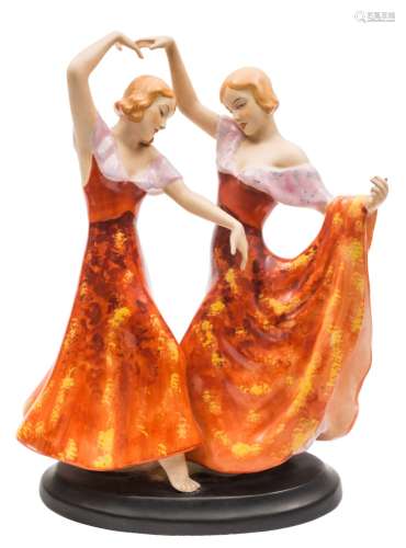 A Royal Dux Art Deco group of two Spanish dancers: in exotic pose and wearing pink trimmed red and