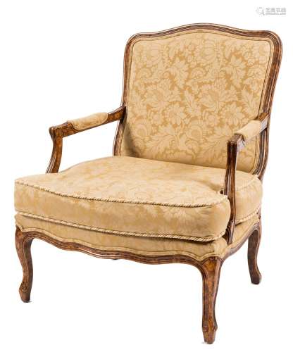 A French grained walnut open armchair in the Louis XV provincial taste:,