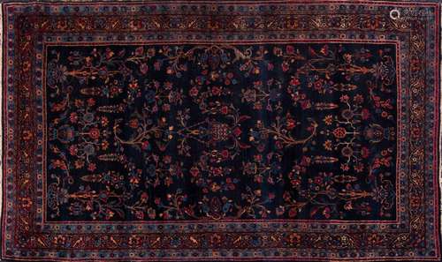 A Meshed rug:, the indigo field with palmette and floral foliate sprays,