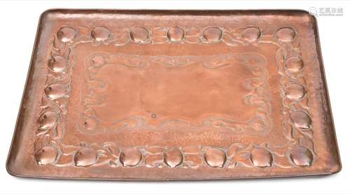 A Newlyn copper tray: of rectangular outline, with embossed fruit and foliate decoration,