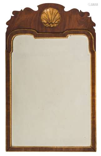 A 19th Century walnut and partly gilt wall mirror:, in the early 18th Century manner,