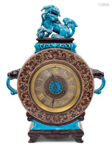 A blue glazed Chinese style mantel clock: the eight-day duration movement striking the hours and