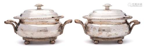 A pair of Sheffield plate tureens and covers: of oval outline with domed lift-off lids,