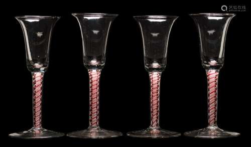 A set of four Dutch colour twist wine glasses: each bell shaped bowl set on a straight double