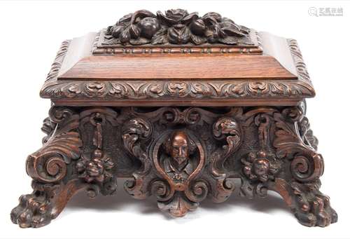 A 19th century carved oak casket: of sarcophagus outline,