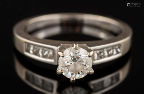 An 18ct white gold and diamond ring: the round, brilliant-cut diamond estimated to weigh 0.