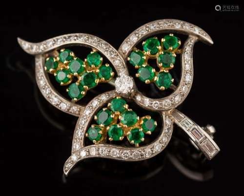 An emerald and diamond spray leaf brooch: pave-set with single-cut diamonds and circular emerald